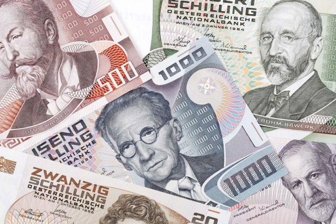 A collection of Austrian Schilling banknotes displayed in overlapping layers. Denominations include 1000, 20, and 10 Schilling, with intricate designs and text indicating 'Österreichische Nationalbank'. The notes feature detailed patterns and numeric values prominently visible.